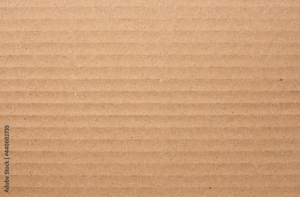 Fototapeta premium Cardboard sheet texture background, detail of recycle brown paper box pattern.