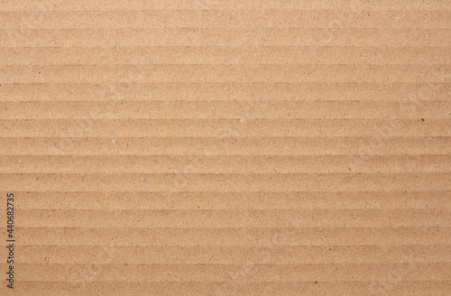 Cardboard sheet texture background, detail of recycle brown paper box pattern.