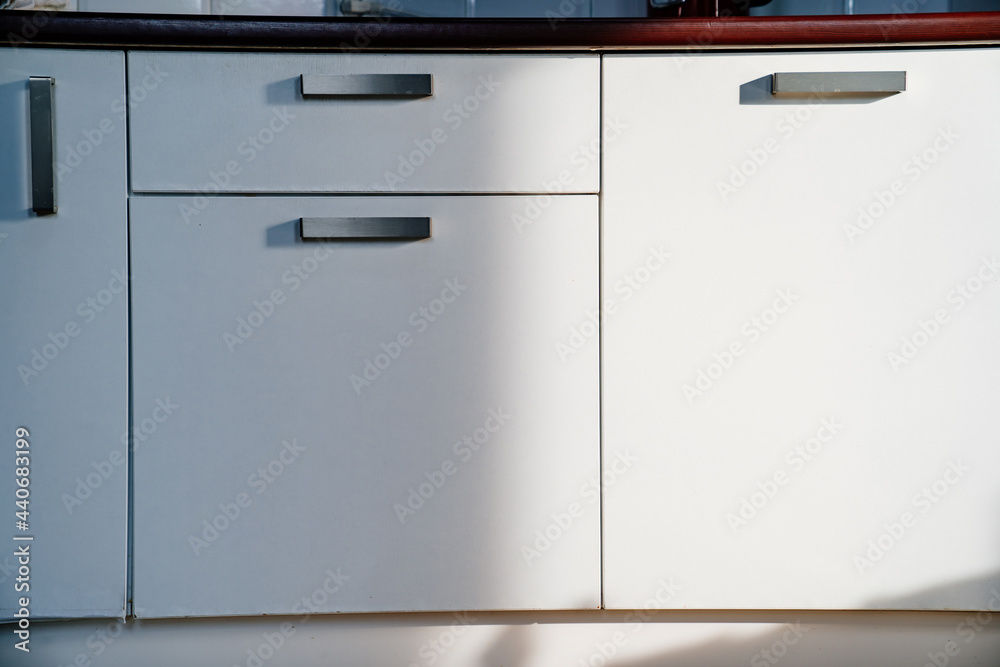 white doors of the kitchen cupboard. furniture for interior of the house. white doors of the kitchen cupboard. furniture for interior of the house.