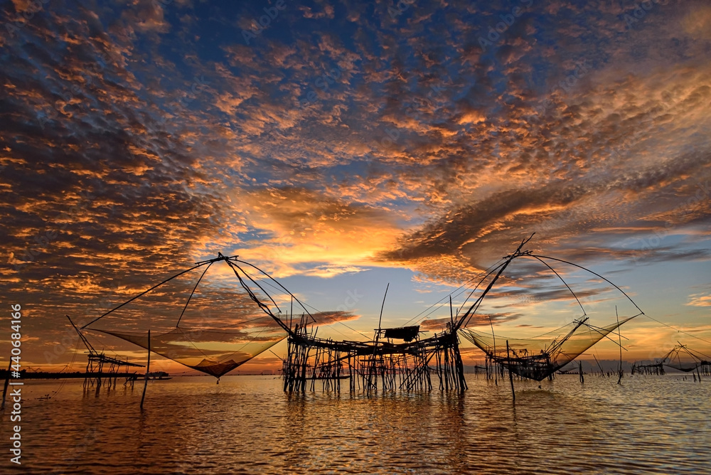 Beautiful landscape morning sky sunrise, Fishing using giant nets Thale Noi Wetlands
