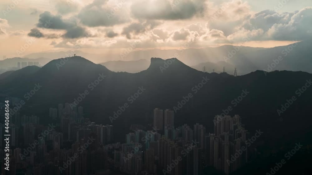 Beautiful city scape with fiery sky vibrant sunset, thick clouds passing into the city time lapse in Tai Po, Hong Kong. parallax time lapse shot of modern skyline office, condo before sunset. Beautiful city scape with fiery sky vibrant sunset, thick clouds passing into the city time lapse in Tai Po, Hong Kong. parallax time lapse shot of modern skyline office, condo before sunset.