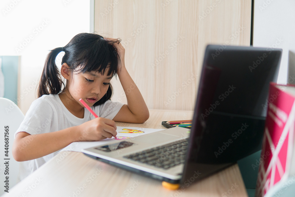 Asian girl student online learning class study online with laptop at home. Asian girl student online learning class study online with laptop at home.