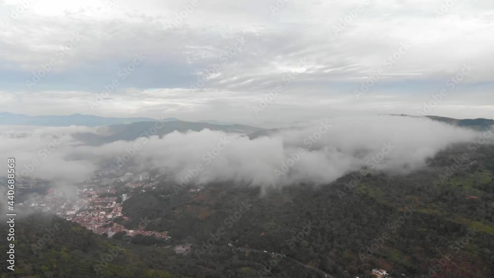 Drone view of misty morning in a village in middle of mountains Drone view of misty morning in a village in middle of mountains