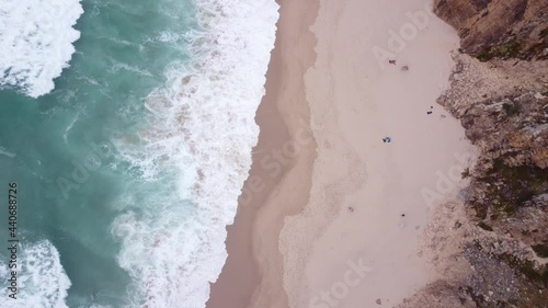 AERIAL Top Down Fly-By of the Wild Waves at Praia da Ursa, Portugal photo