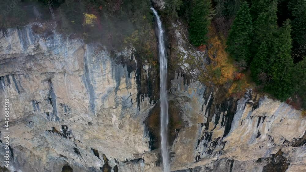 Amazing waterfall over the mountain rocks falling down on a bright day in Lauterbrunnen, Switzerland. Aerial footage Amazing waterfall over the mountain rocks falling down on a bright day in Lauterbrunnen, Switzerland. Aerial footage