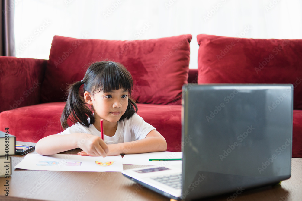 Asian girl student online learning class study online with laptop at home. Asian girl student online learning class study online with laptop at home.