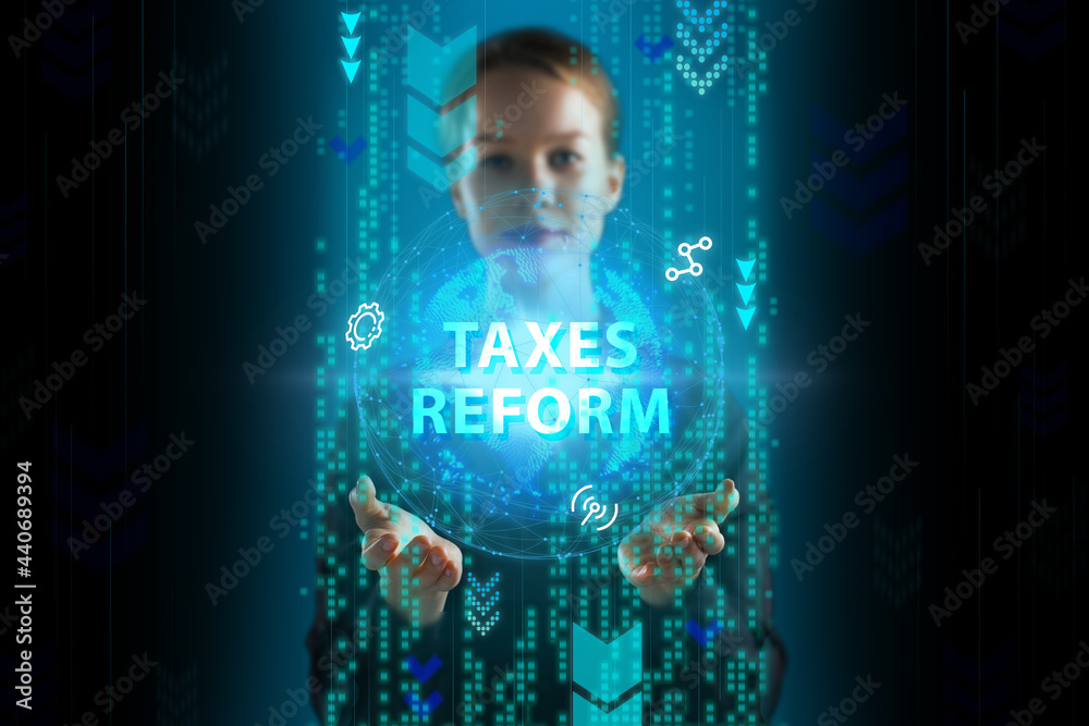 Business, Technology, Internet and network concept. Young businessman working on a virtual screen of the future and sees the inscription: Taxes reform Business, Technology, Internet and network concept. Young businessman working on a virtual screen of the future and sees the inscription: Taxes reform