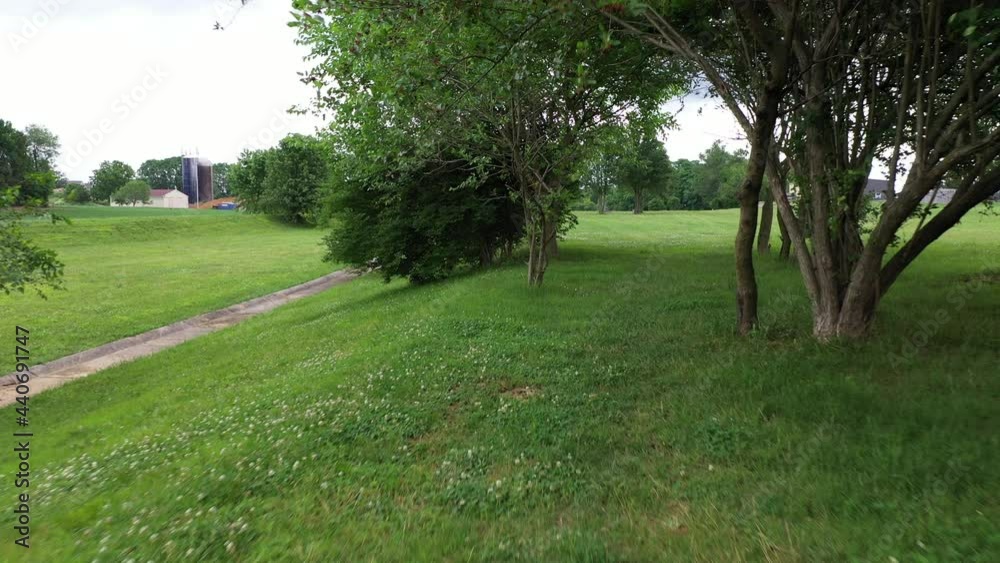 Frisbee, disc golf flight path at hole number 7. Challenging course in Lancaster Pennsylvania from tee pad to basket. Series available. Frisbee, disc golf flight path at hole number 7. Challenging course in Lancaster Pennsylvania from tee pad to basket. Series available.