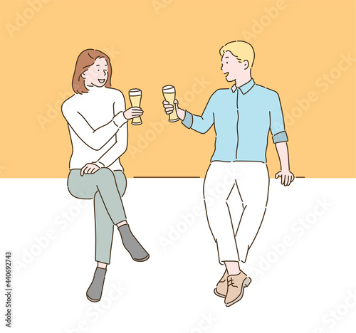 Two people are toasting while holding beer glasses in their hands. hand drawn style vector design illustrations. 