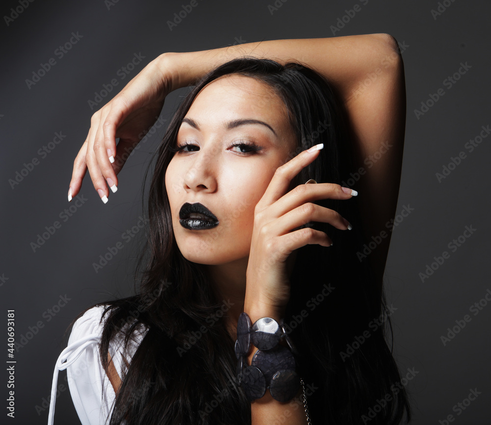 Obraz premium Close up portrait of Beautiful young asian female model with black lips and long hair