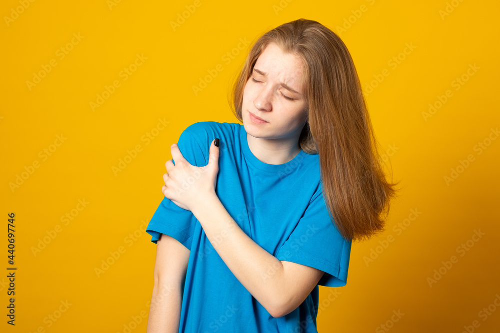 Cute girl suffering from arm pain, painful in arm muscles. Health concept. Cute girl suffering from arm pain, painful in arm muscles. Health concept.