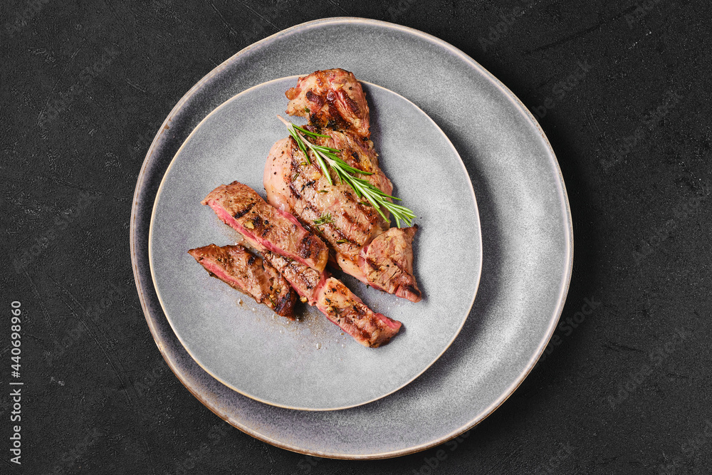 Overhead view of ribeye steak on a plate