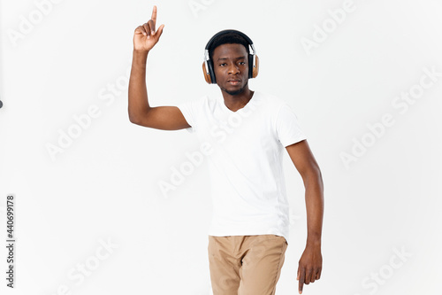 man in headphones gesturing with hands music technology fun isolated background