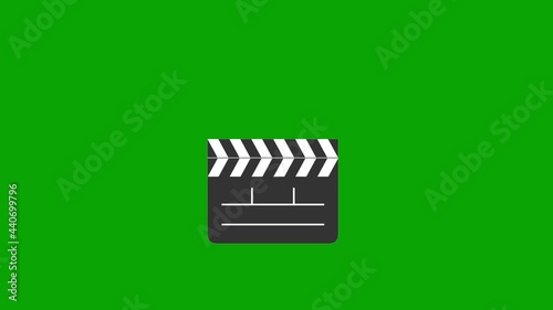 ANIMATION - Movie clapboard clapper opens, closes, copy space, green background photo
