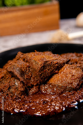 Beef Rendang is a Minang dish originating from the Minangkabau region in West Sumatra, Indonesia.  Rendang has been slow cooked and braised in a coconut milk seasoned with a herb and spice mixture