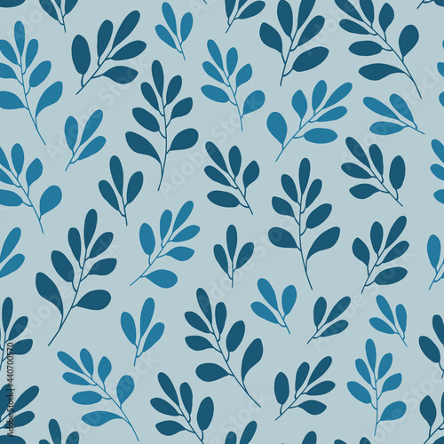 Seamless pattern with blue leaves and simple branches on a light blue background. Decorative herbal forms. For printing textiles, gift wrapping, wallpaper.