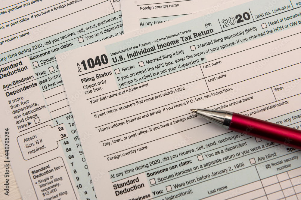 close up of empty us tax form 1040 and ballpoint pen close up of empty us tax form 1040 and ballpoint pen