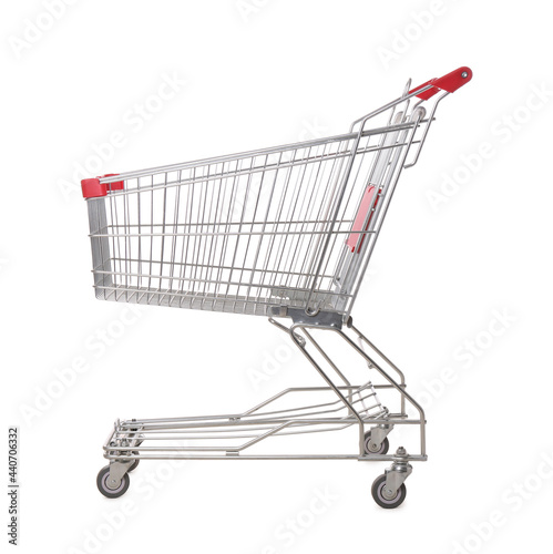 Empty metal shopping cart isolated on white © New Africa
