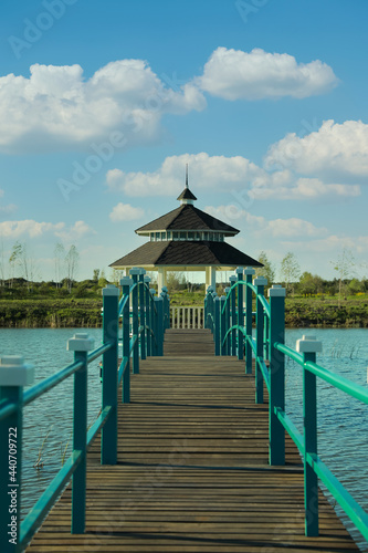 Beautiful view of bridge and gazebo on lake