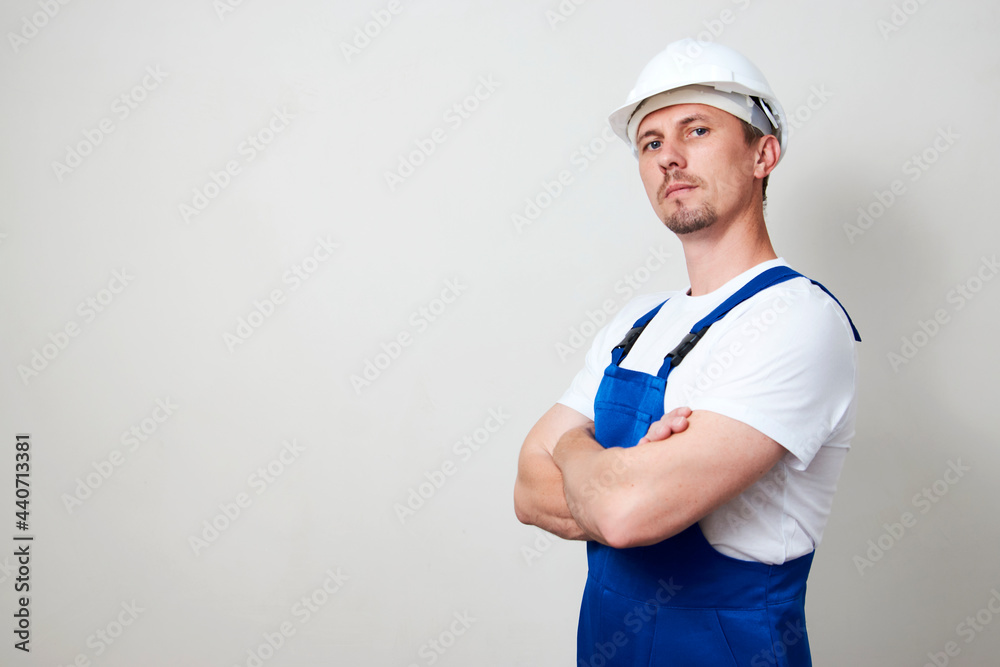 Portrait of young handyman standing on white background Portrait of young handyman standing on white background