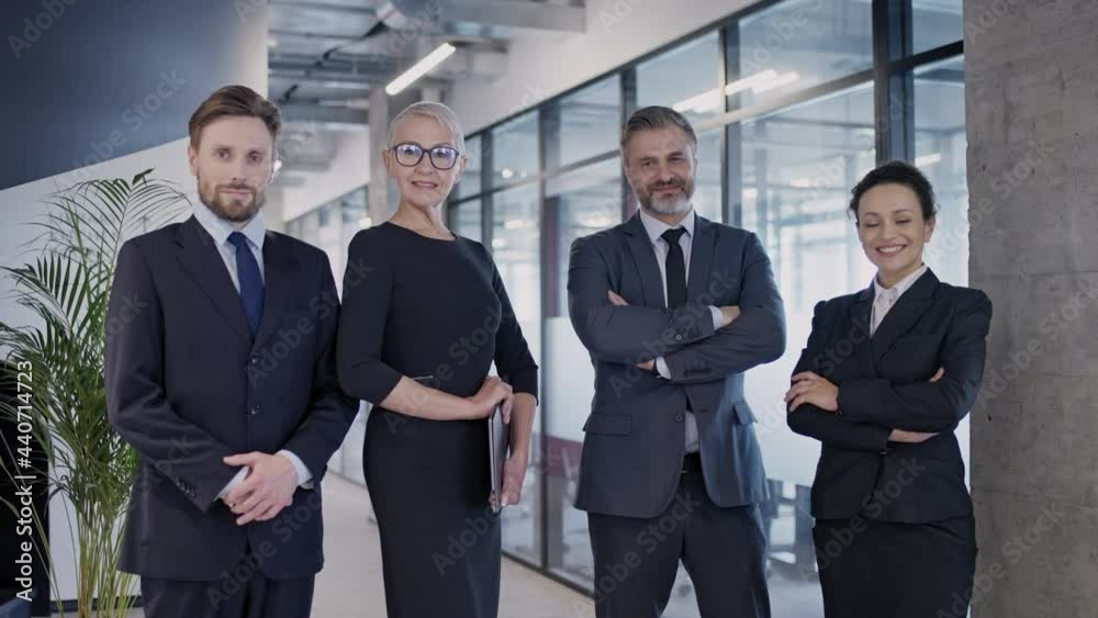 Professional lawyers posing on camera, reliable law firm, trustworthy team Professional lawyers posing on camera, reliable law firm, trustworthy team