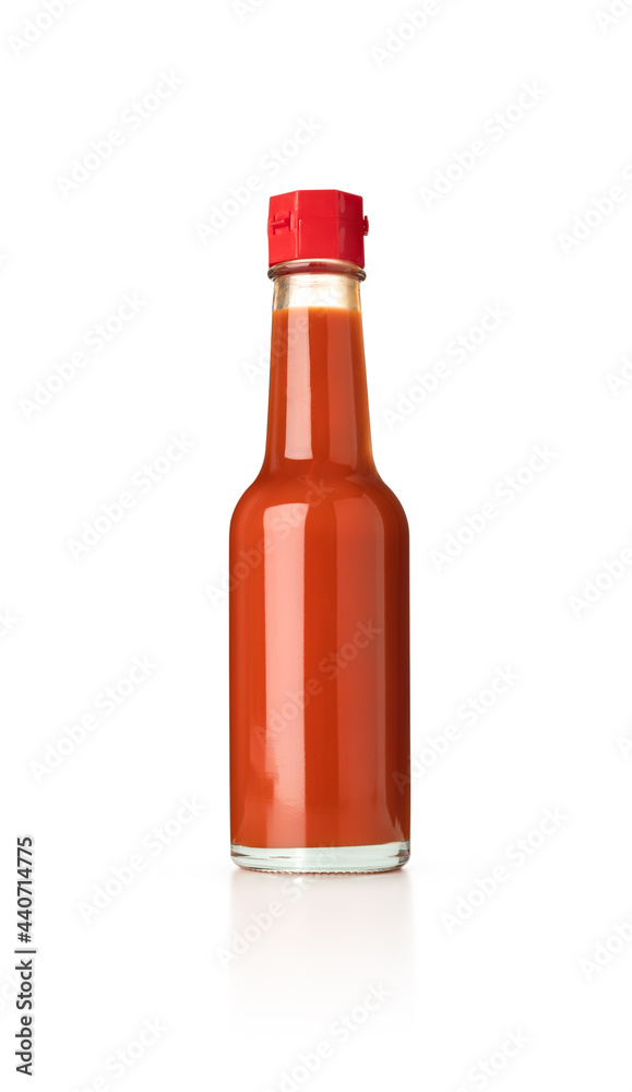 Mexican chili sauce in glass bottle on isolated white background Mexican chili sauce in glass bottle on isolated white background