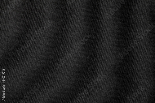 Black cotton cloth texture texture background. Close-up.