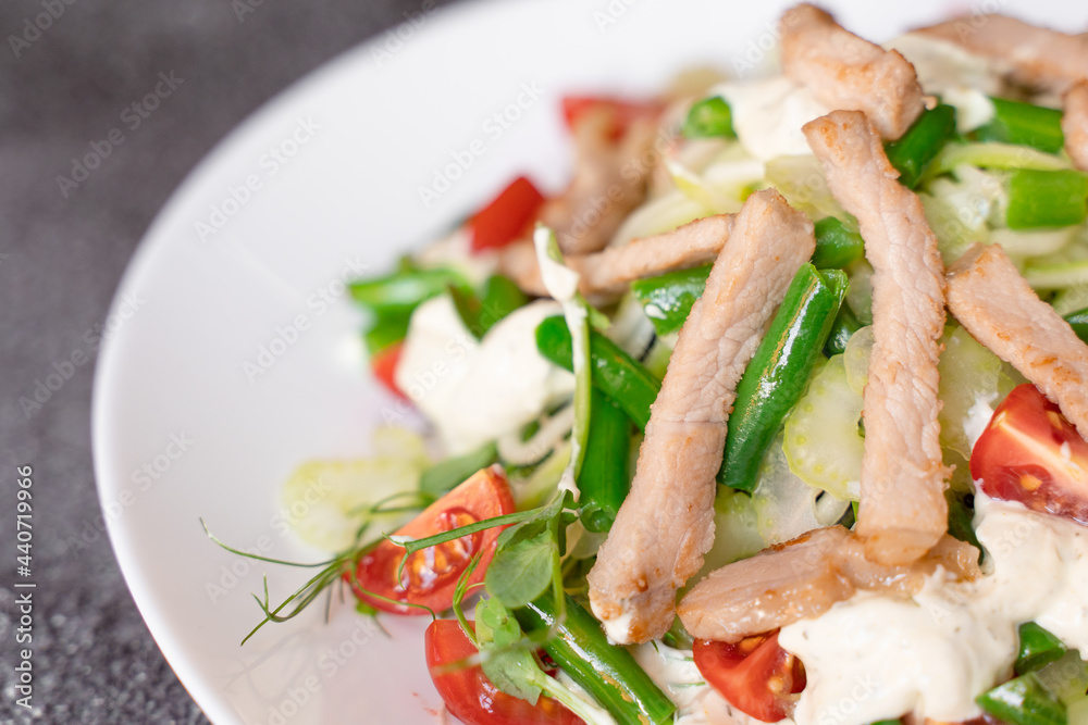 Caesar salad with chicken and parmesan, cherry tomato, lettuce, croutons and egg Caesar salad with chicken and parmesan, cherry tomato, lettuce, croutons and egg