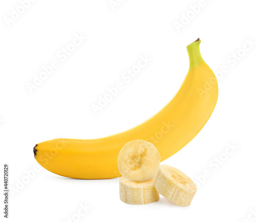 Delicious ripe banana and pieces on white background