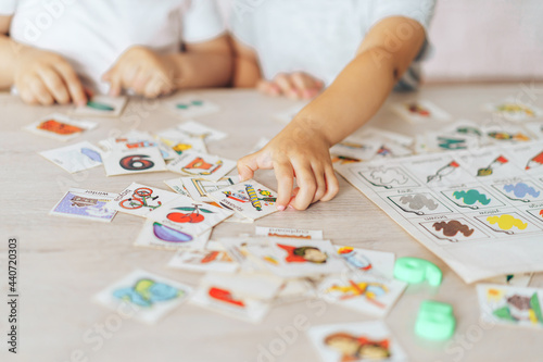 Boy and girl play educational games at school desk