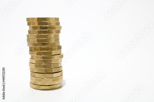 Single stack of one pound coins isolated on white background, with copy space