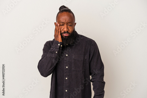 African american man with beard isolated on pink background who feels sad and pensive, looking at copy space.