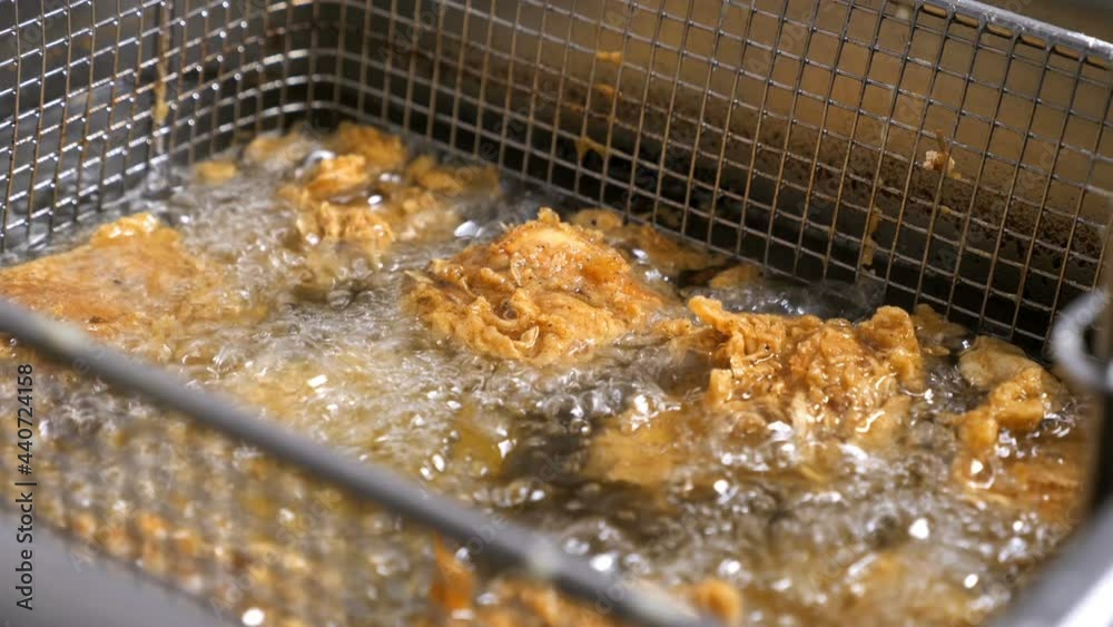 in a restaurant kitchen, preparation of appetizing fried chicken