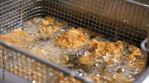 in a restaurant kitchen, preparation of appetizing fried chicken