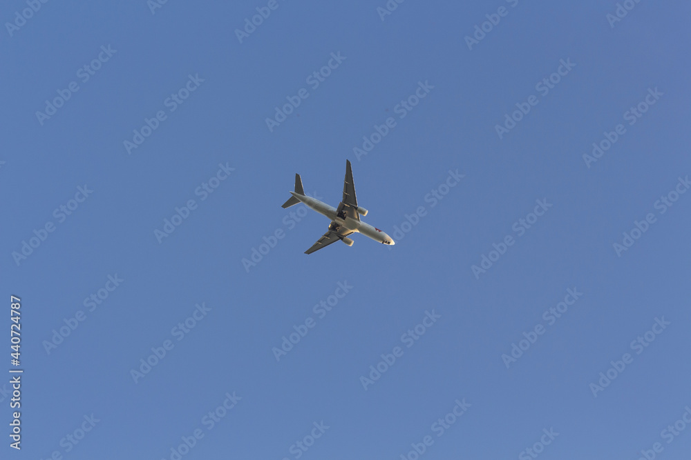 Airplane in the sky. Clear, cloudless sky. Air travel. Airplane in the sky. Clear, cloudless sky. Air travel.