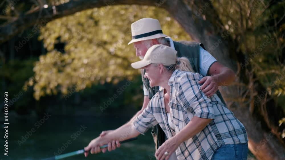 Old Man Teaches The Grandmother How To Use A Fishing Rod Old Man Teaches The Grandmother How To Use A Fishing Rod
