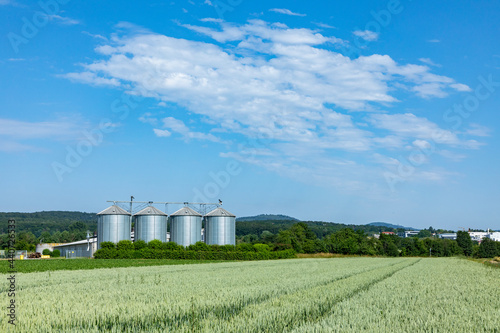 silo at the field for corn under blue sky © travelview