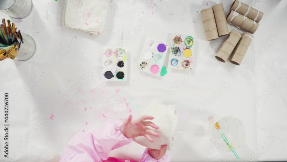 Flat lay. Kids papercraft. Painting empty toilet paper rolls with acrylic paint to create paper bugs. Flat lay. Kids papercraft. Painting empty toilet paper rolls with acrylic paint to create paper bugs.