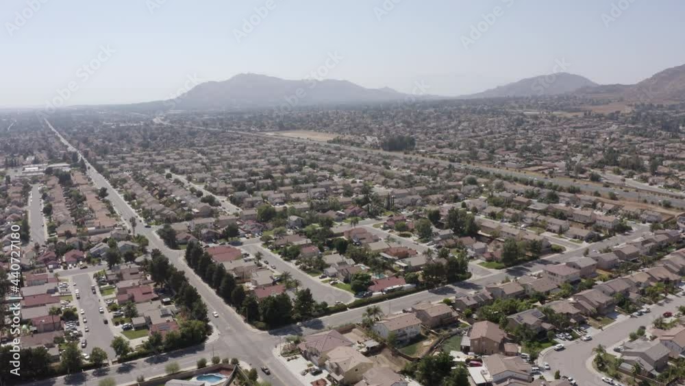 Daytime aerial view of a suburban neighborhood in Moreno Valley, California, USA. Daytime aerial view of a suburban neighborhood in Moreno Valley, California, USA.