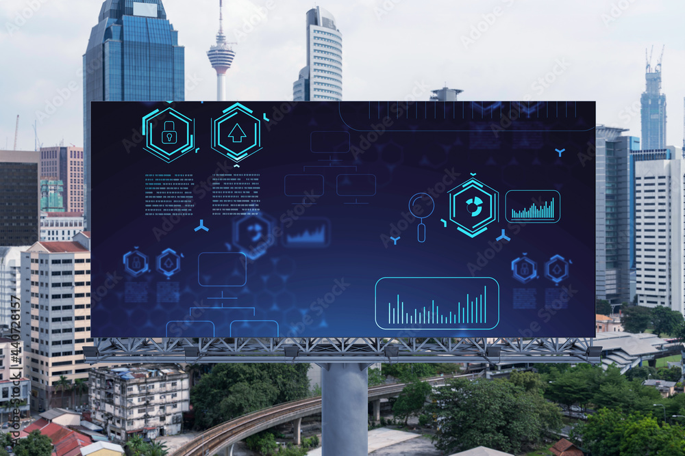 Obraz premium Technology hologram on billboard over panorama city view of Kuala Lumpur. KL is the largest tech hub in Malaysia, Asia. The concept of developing coding and high-tech science.