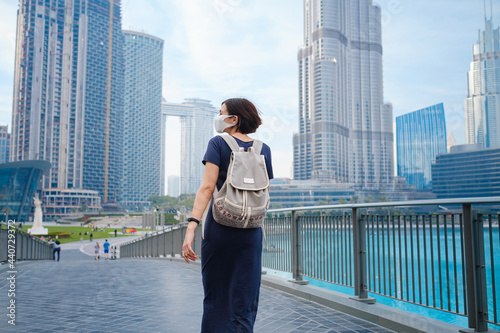 Young beautiful woman enjoying the view of Dubai downtown.