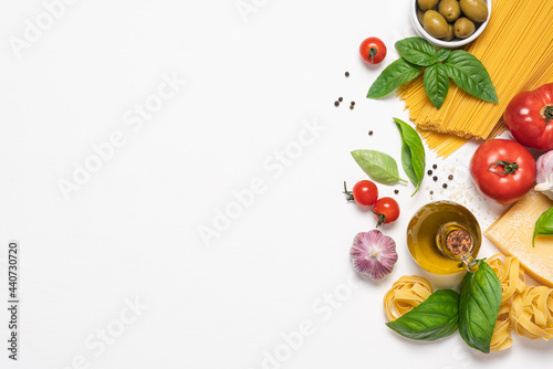 Fototapeta Naklejka Na Ścianę i Meble -  Italian cuisine white background with copy space. Traditional Mediterranean food. Vegetables, pasta, spices and herbs. Menu or recipe concept