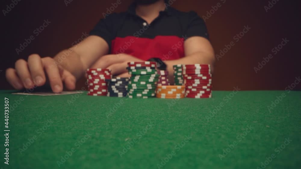 Close up of man playing card game in casino Close up of man playing card game in casino