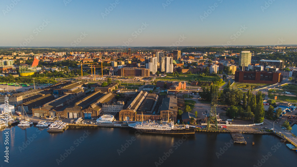 View of the Imperial Shipyard and the Young City in Gdańsk. Shipyards and a view of the city of Gdańsk in the background.