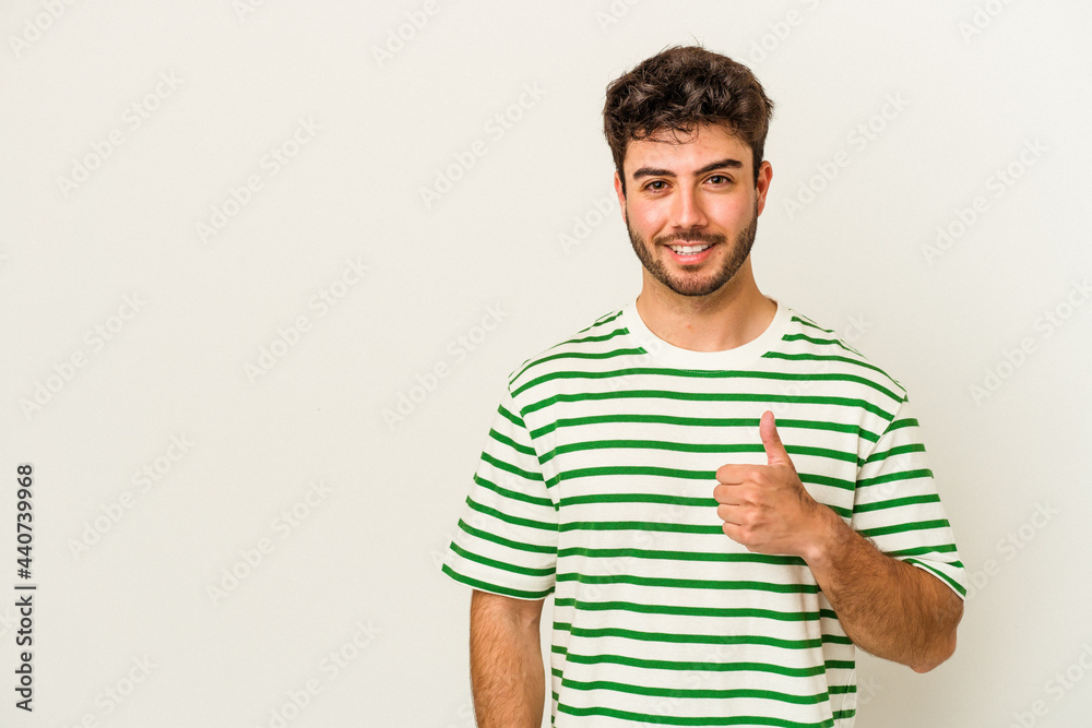 Young caucasian man isolated on white background smiling and raising thumb up Young caucasian man isolated on white background smiling and raising thumb up