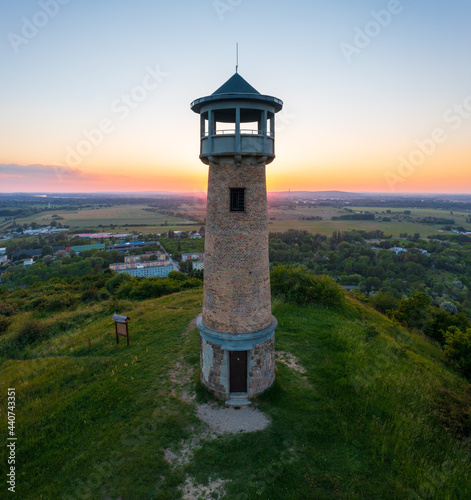 Beautiful aerial sunset landscape about Strazsa Hill with lookout tower which is located near Esztergom  in the Pilis Mountains. Dorog city at the background.