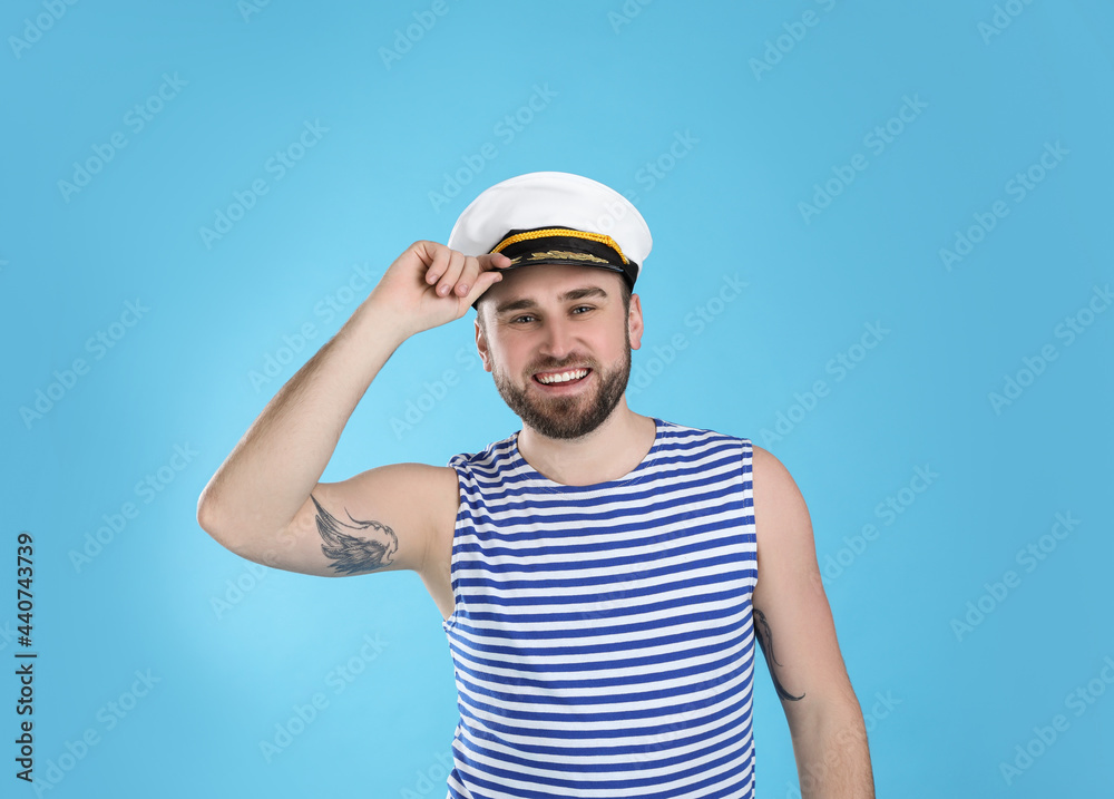 Portrait of sailor on light blue background