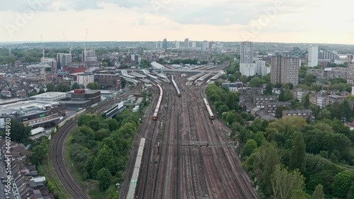 Dolly forward drone shot towards busy clapham junction train station London photo