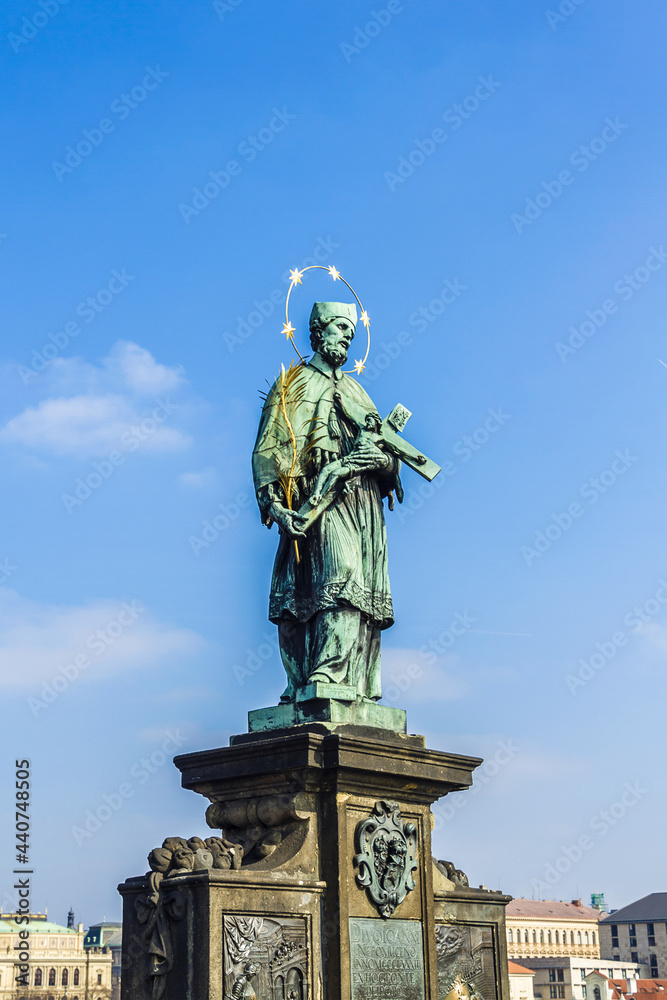 Obraz premium Statue on Charles Bridge (Karluv most, 1357) - famous historic bridge that crosses Vltava River in Prague. Bridge decorated by 30 statues. Prague, Czech Republic.