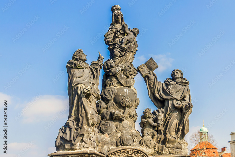Statue on Charles Bridge (Karluv most, 1357) - famous historic bridge that crosses Vltava River in Prague. Bridge decorated by 30 statues. Prague, Czech Republic.